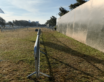 A festival entrance showing barriers that are wide enough for people with extenuating circumstances to pass the queue